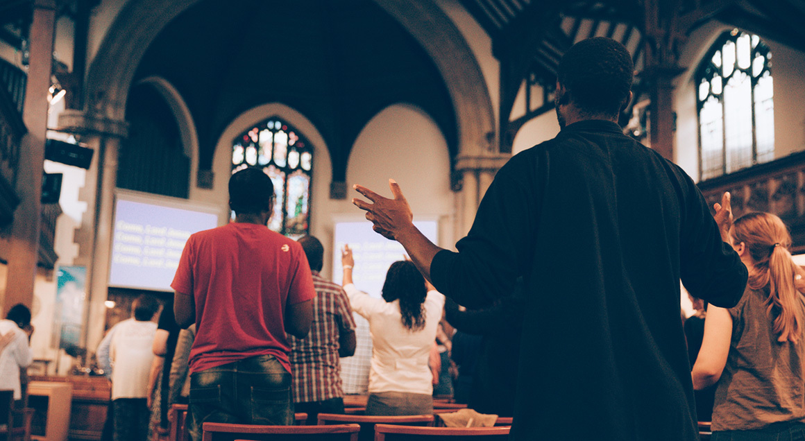 Congregation worshiping in church