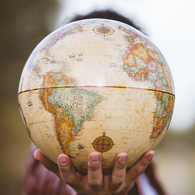 Hand holding globe 400x400
